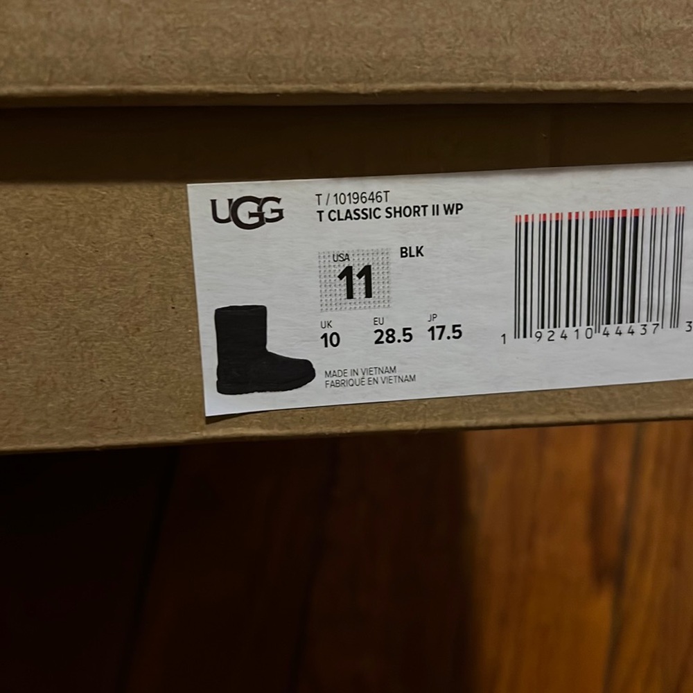 Brand new. Unworn Pair of black waterproof Classic II UGGs toddler size 11.